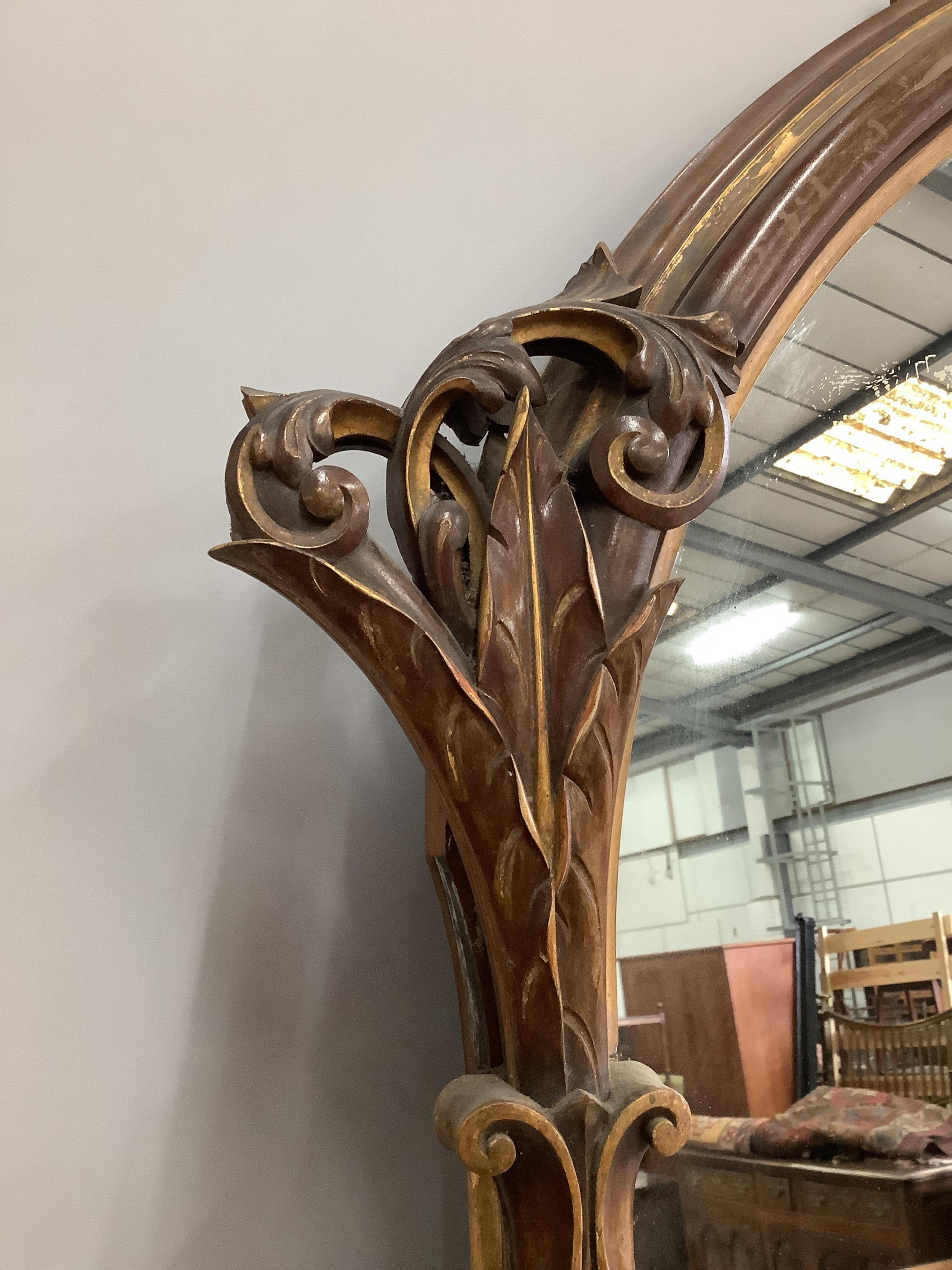 A Victorian parcel-gilt mahogany overmantel mirror, with partial plate, width 146cm, height 206cm. Condition - fair